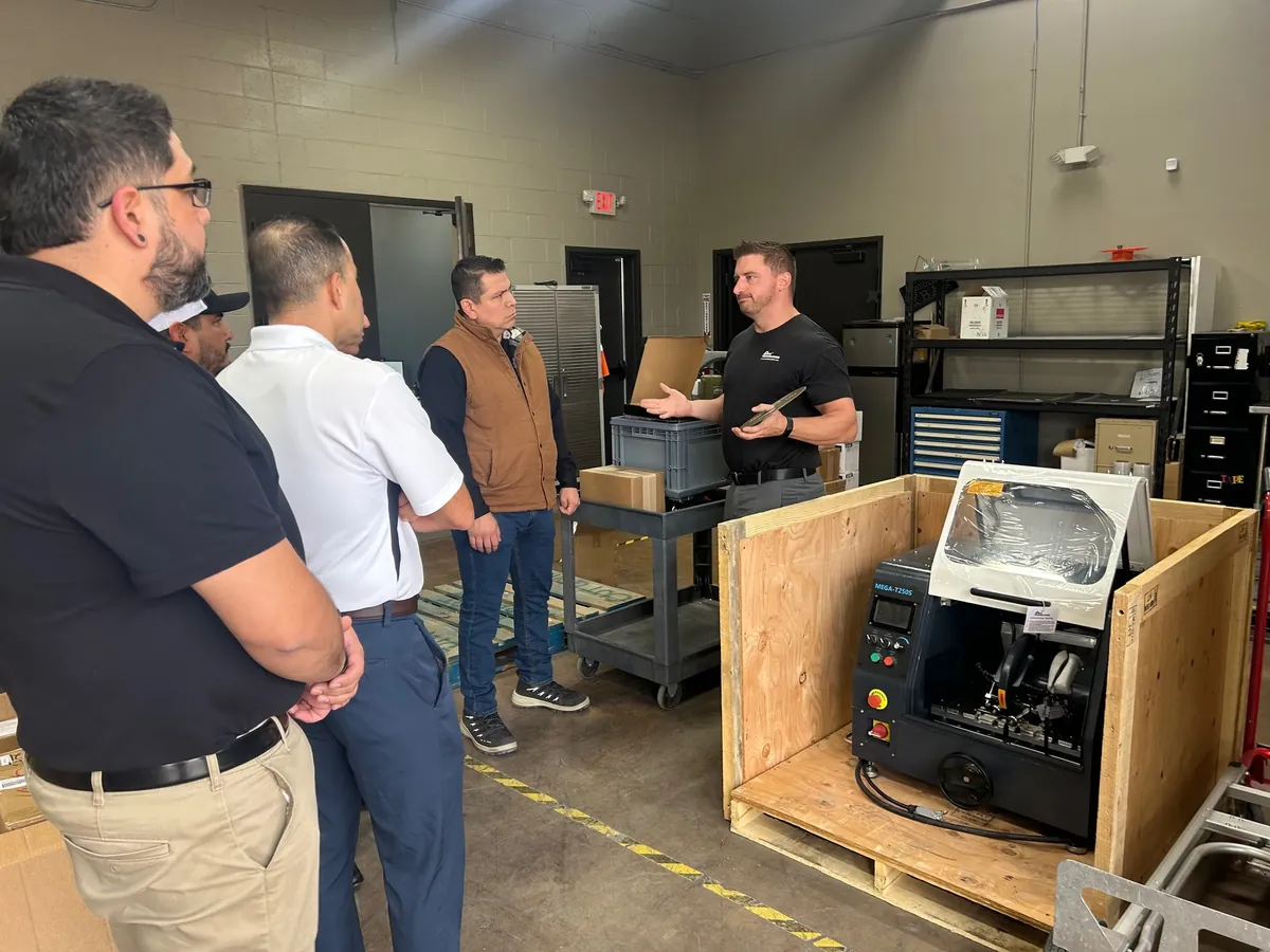 PACE Technologies engineer walking a customer team through an automated cutter installation